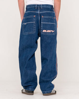 Man wearing Flip Daddy 2.0 Jean - Deep Sea Blue in Deep Sea Blue / Orange