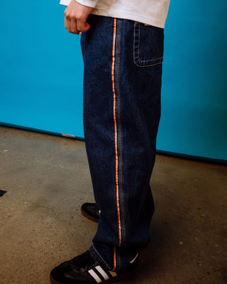 Man wearing Flip Daddy 2.0 Jean - Deep Sea Blue in Deep Sea Blue / Orange