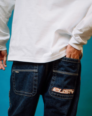 Man wearing Flip Daddy 2.0 Jean - Deep Sea Blue in Deep Sea Blue / Orange