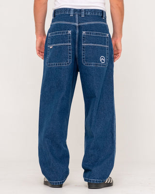 Man wearing Flip Daddy Tapeless Jean - Deep Sea Blue in Deep Sea Blue