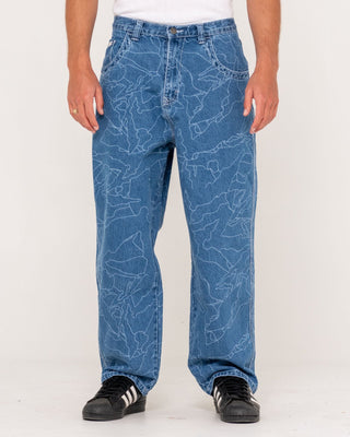 Man wearing Flip Daddy Lazer Tech Denim Jean in Middy Blue