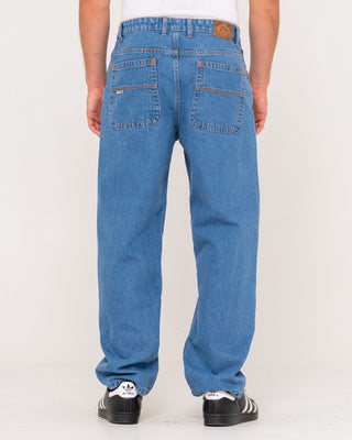 Man wearing Lucifer Loose Jean - Middy Blue in Middy Blue