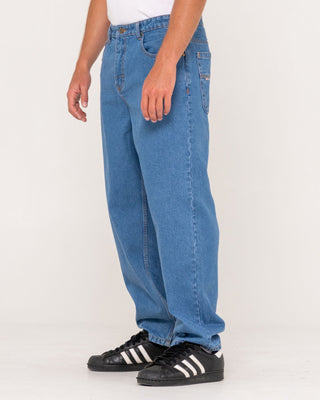 Man wearing Lucifer Loose Jean - Middy Blue in Middy Blue