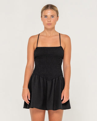 Woman wearing Mimi Smocked Mini Dress in Black
