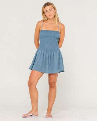 Woman wearing Mimi Smocked Mini Dress in Retro Blue