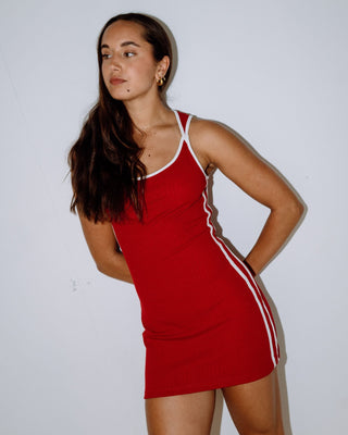 Woman wearing Ashley Ribbed Mini Dress in Red