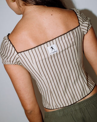 Woman wearing Sandy Button Up Top in Oatmeal Stripe