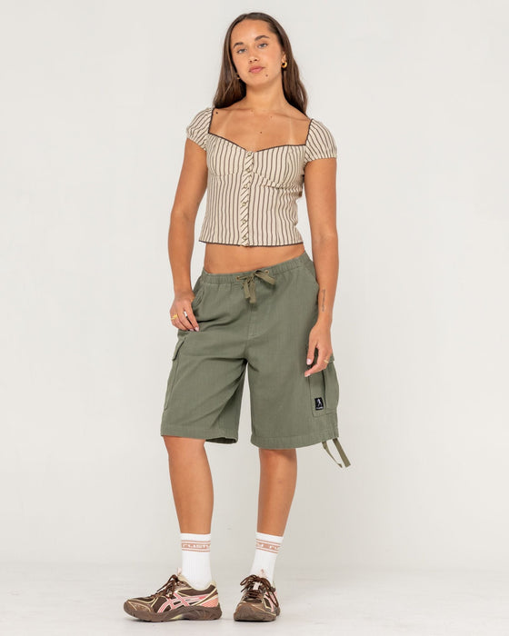 woman-wearing-sandy-button-up-top-in-oatmeal-stripe