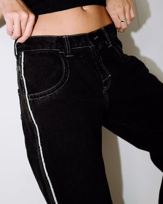 Woman wearing Flip Mommy Low Rise Wide Leg Denim Jean in Black Out