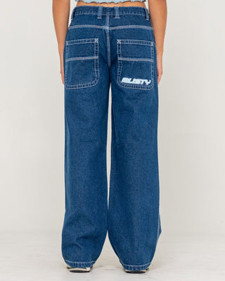 Woman wearing Flip Mommy Low Rise Tapeless Denim Jean in Deep Sea Blue