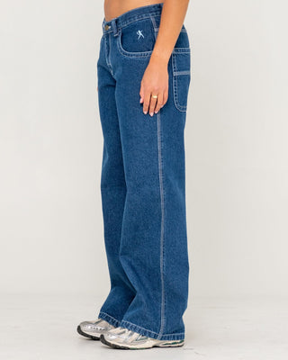 Woman wearing Flip Mommy Low Rise Tapeless Denim Jean in Deep Sea Blue