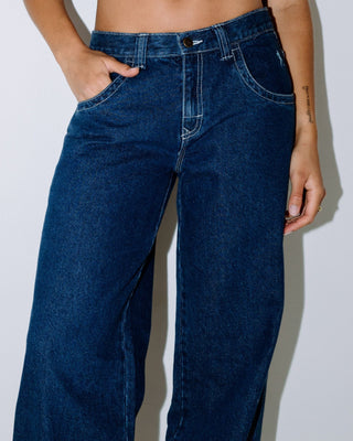 Woman wearing Flip Mommy Low Rise Tapeless Denim Jean in Deep Sea Blue