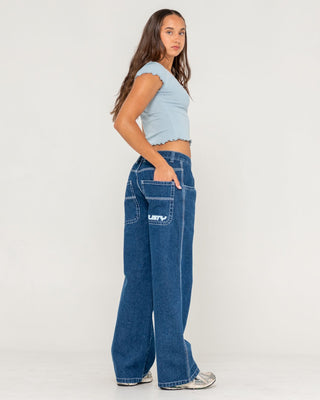 Woman wearing Flip Mommy Low Rise Tapeless Denim Jean in Deep Sea Blue
