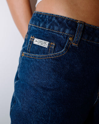 Woman wearing Suzy Straight Low Rise Jean in Authentic Blue