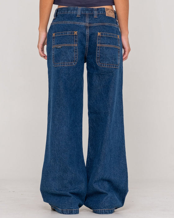 woman-wearing-wendy-wide-low-rise-denim-jean-in-deep-sea-blue