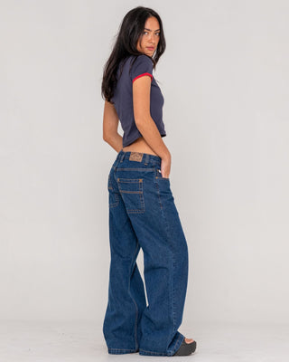 woman-wearing-wendy-wide-low-rise-denim-jean-in-deep-sea-blue