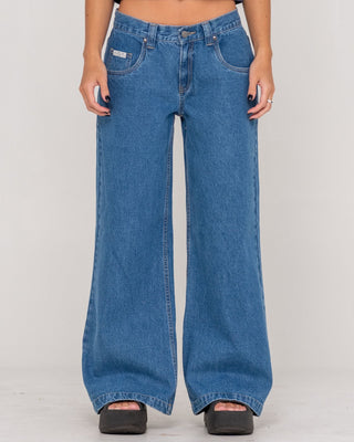 Woman wearing Wendy Wide Low Rise Denim Jean in Middy Blue