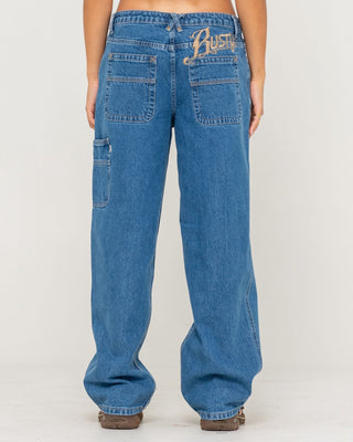 Woman wearing Risque Bethany Baggy Low Rise Denim Jean in Middy Blue