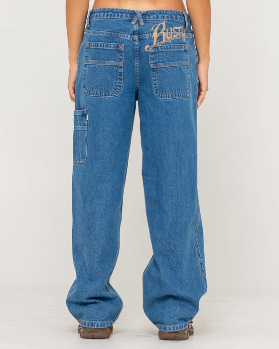 woman-wearing-risque-bethany-baggy-low-rise-denim-jean-in-middy-blue