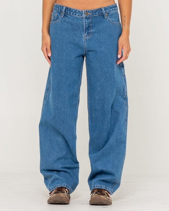 woman-wearing-risque-bethany-baggy-low-rise-denim-jean-in-middy-blue