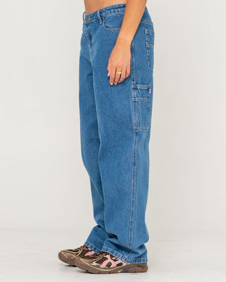 Woman wearing Risque Bethany Baggy Low Rise Denim Jean in Middy Blue