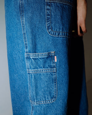 Woman wearing Risque Bethany Baggy Low Rise Denim Jean in Middy Blue