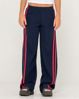 Woman wearing Bronson Low Rise Trackpant in Navy Blue