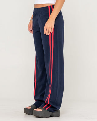 Woman wearing Bronson Low Rise Trackpant in Navy Blue