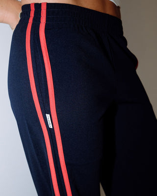 Woman wearing Bronson Low Rise Trackpant in Navy Blue