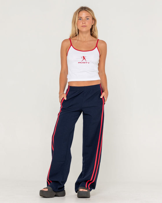 woman-wearing-bronson-low-rise-trackpant-in-navy-blue