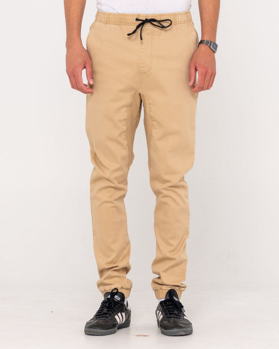 man-wearing-hook-out-elastic-pant-in-khaki