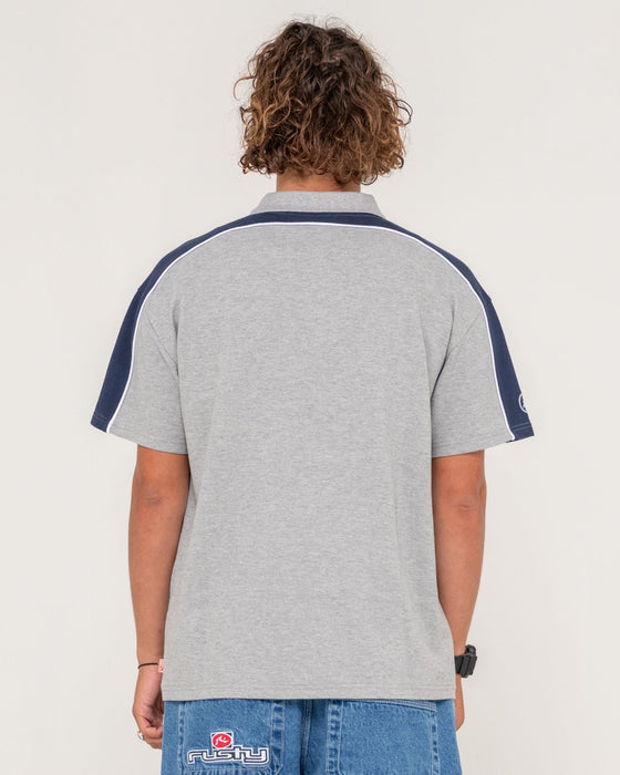 man-wearing-straight-shooter-short-sleeve-polo-in-grey-marle