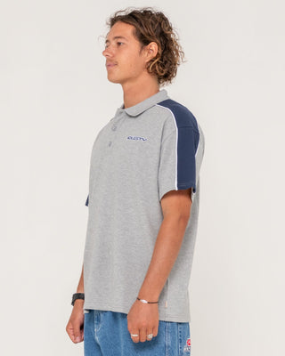 Man wearing Straight Shooter Short Sleeve Polo in Grey Marle