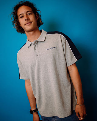 Man wearing Straight Shooter Short Sleeve Polo in Grey Marle