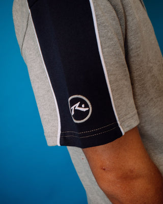 Man wearing Straight Shooter Short Sleeve Polo in Grey Marle