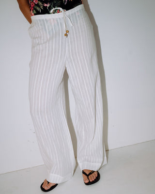 Woman wearing Cici Sheer Beach Pant in White