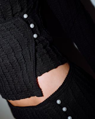 Woman wearing I Kissed A Pearl Lace Wrap L/S Top in Black