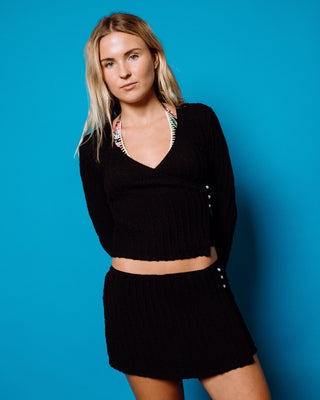 Woman wearing I Kissed A Pearl Lace Wrap L/S Top in Black