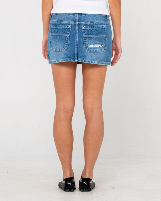 woman-wearing-flip-mommy-low-rise-mini-denim-skirt-in-blasted-middy-blue-blue