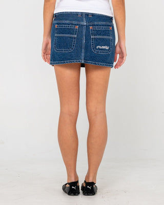 Woman wearing Flip Mommy Low Rise Mini Denim Skirt in Deep Sea Blue / Orange