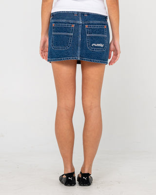 Woman wearing Flip Mommy Low Rise Mini Denim Skirt in Deep Sea Blue / Orange