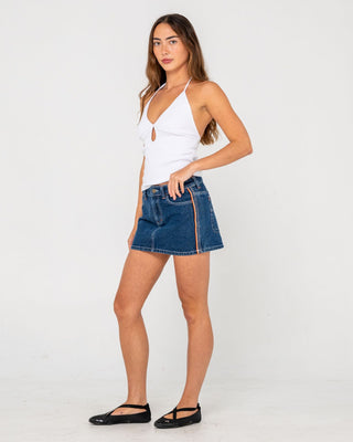 Woman wearing Flip Mommy Low Rise Mini Denim Skirt in Deep Sea Blue / Orange