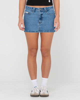 Woman wearing Mavericks Low Rise Denim Mini Skirt in Middy Blue