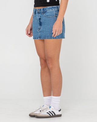 Woman wearing Mavericks Low Rise Denim Mini Skirt in Middy Blue