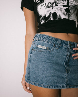 Woman wearing Mavericks Low Rise Denim Mini Skirt in Middy Blue