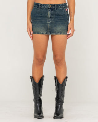 Woman wearing Billie Low Rise Denim Mini Skirt in Dark N Dirty