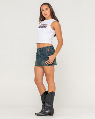 Woman wearing Billie Low Rise Denim Mini Skirt in Dark N Dirty