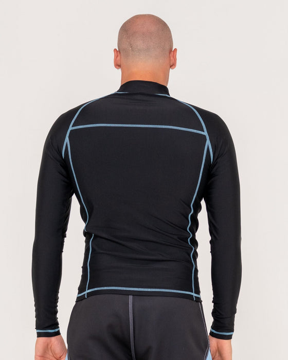 man-wearing-gnaraloo-long-sleeve-surf-top-in-black