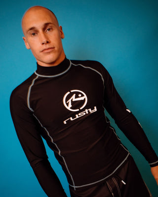 Man wearing Gnaraloo Long Sleeve Surf Top in Black