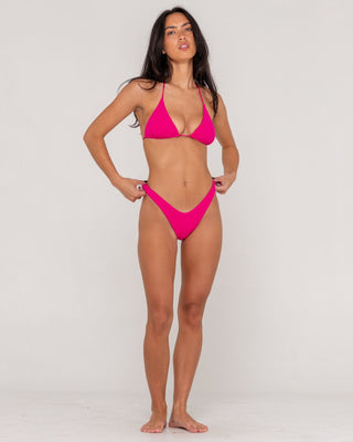 woman-wearing-sandalwood-midi-bikini-bottom-in-fuchsia